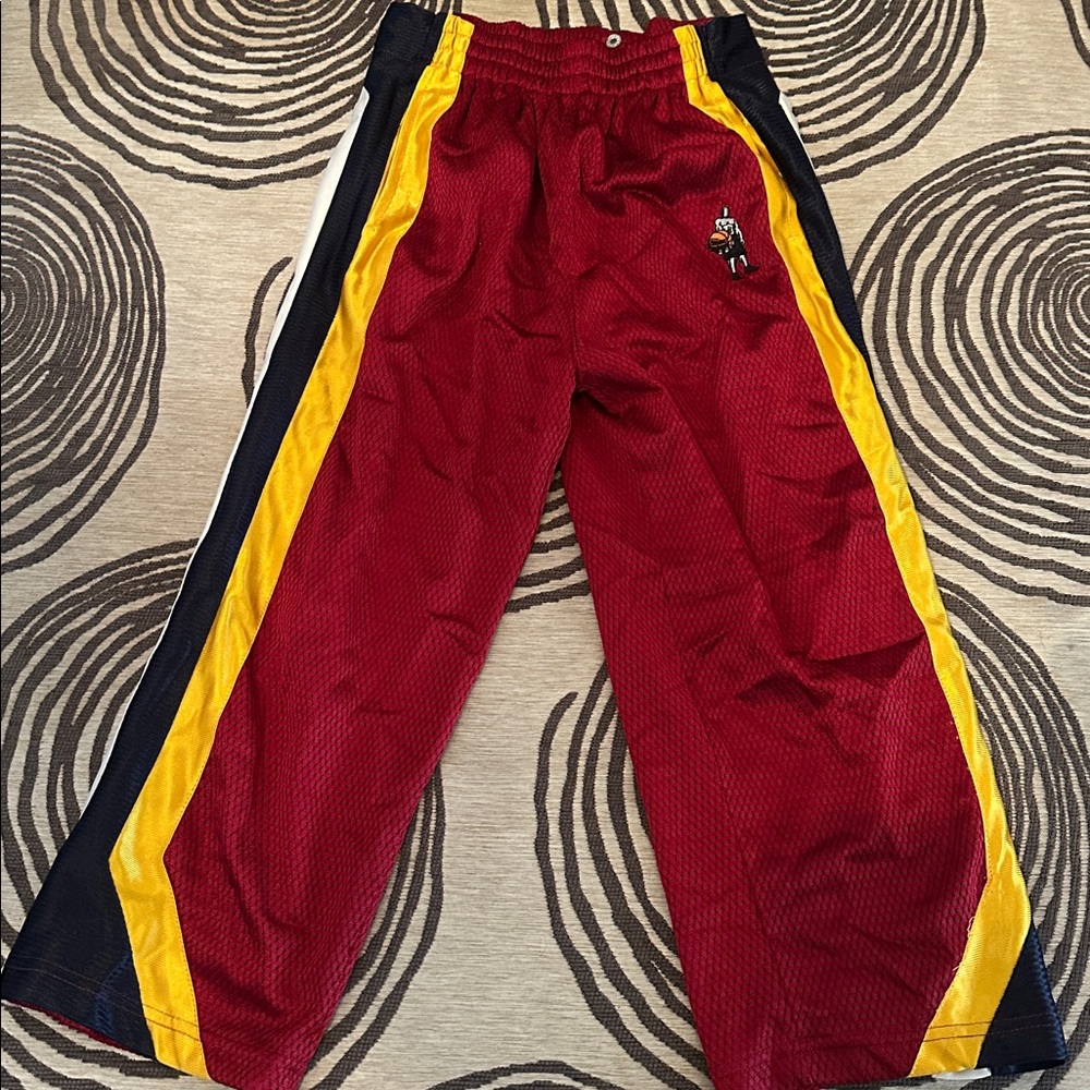 Red Athletic Pants with Yellow and Black Stripes